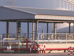 Industrial steel structure, featuring a covered facility with exposed piping and equipment. Engineered for heavy-duty operations and industrial processing environments.