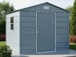 Compact blue metal storage shed with a gable roof and single door, for residential use. The shed features durable steel panels, a side window for ventilation, and a clean modern look.
