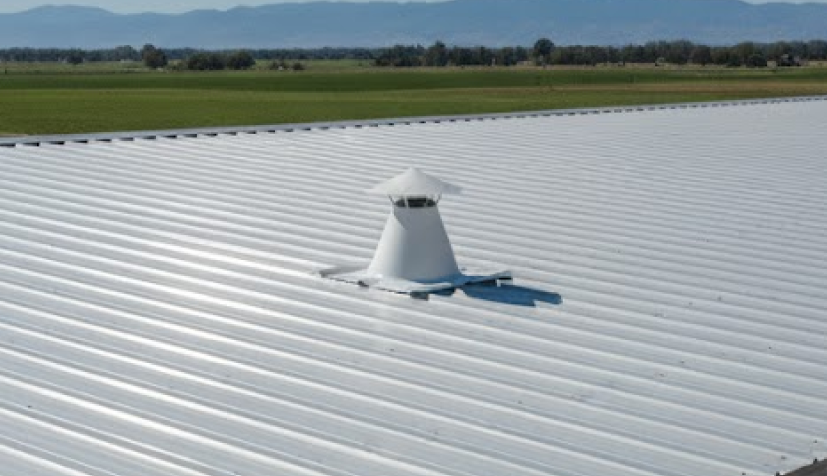Metal building roof with a roof jack installed at the center, highlighting steel building accessories used for ventilation and weather protection.