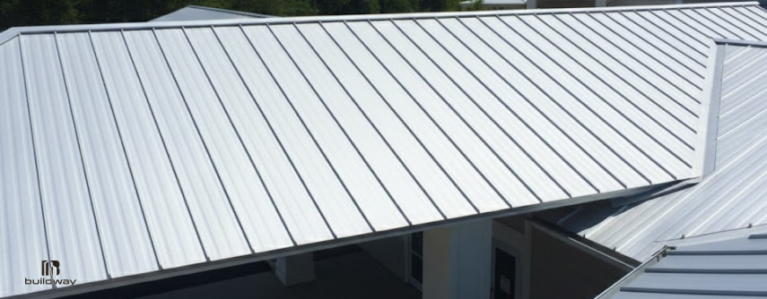 Standing seam coated steel roof panels installed on a building.