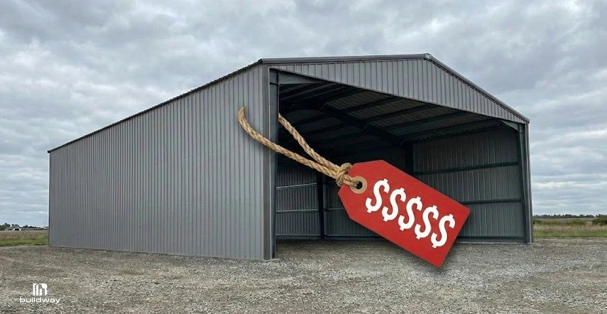 Large empty steel shed with a red price tag showing dollar signs, suggesting high cost.